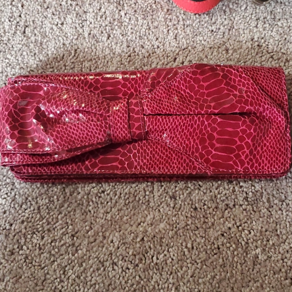 Nine West Raspberry bow snakeskin clutch